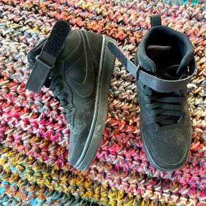 Black suede hightop Air Force 1s